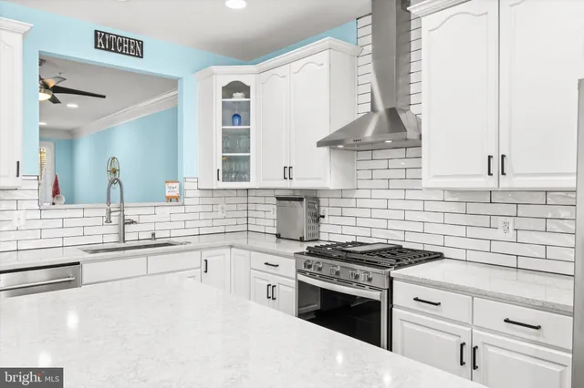 a bedroom with a bed and wall painting