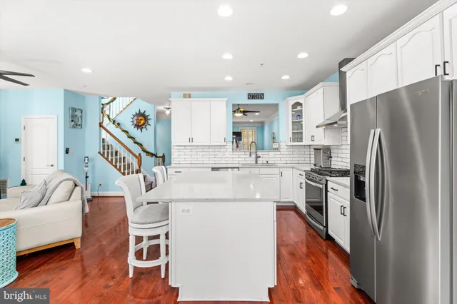 a bathroom with a sink a toilet and shower curtain