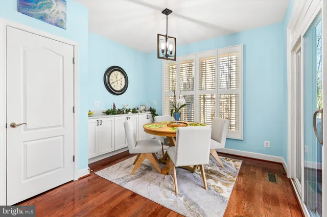 a spacious bedroom with a bed and a chandelier
