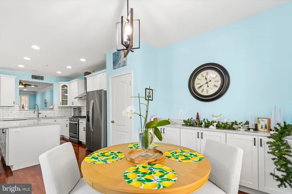 a view of walk in closet with clothes