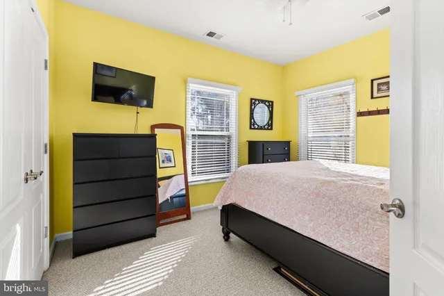 a living room with stainless steel table tennis table and wooden floor