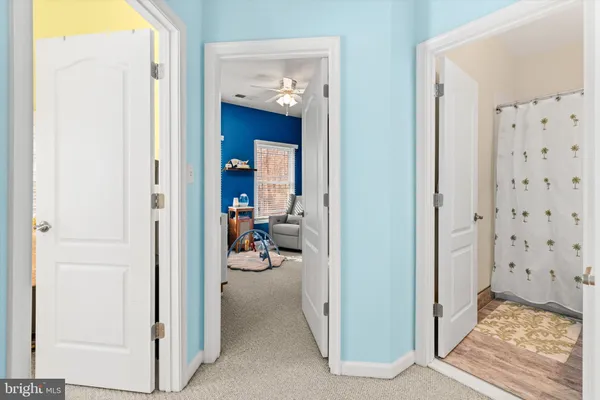 an aerial view of residential houses with outdoor space and swimming pool