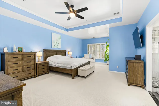 a view of a swimming pool with an outdoor seating and a lake view