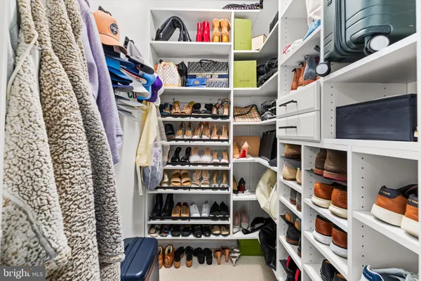 an aerial view of a house with swimming pool and garden