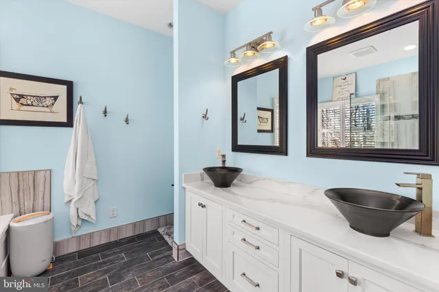 a aerial view of a multi story residential apartment building with a yard