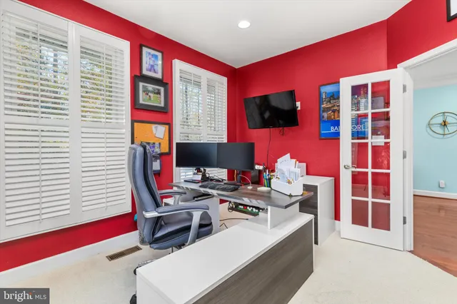 a view of a white house with a big yard and large trees