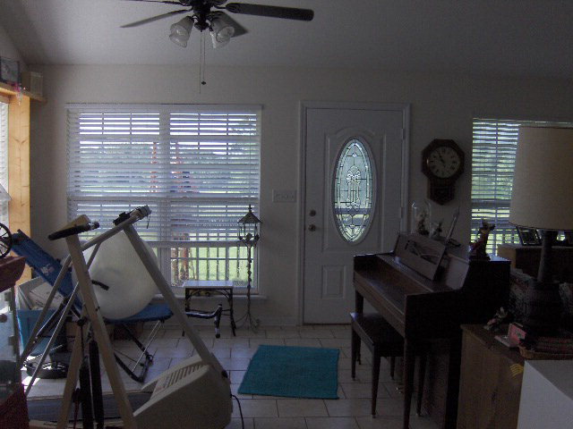 174 Buck Road Gray, GA 31032 - Photo 2 of 25 a living room with furniture a window and a chandelier