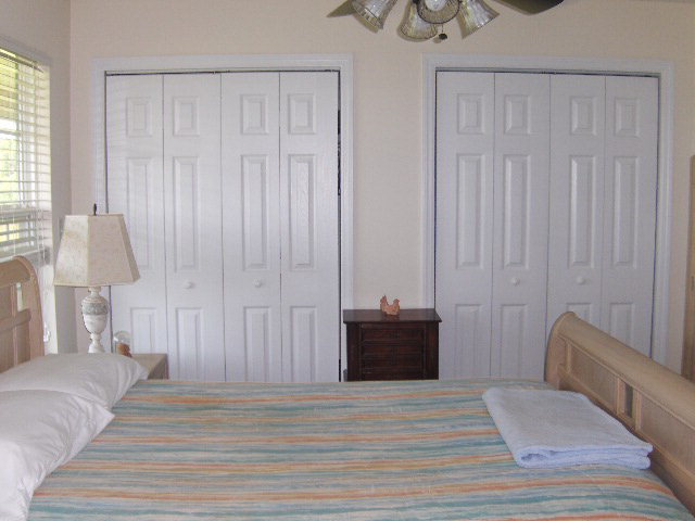 174 Buck Road Gray, GA 31032 - Photo 11 of 25 a view of a bedroom with wooden floor and furniture