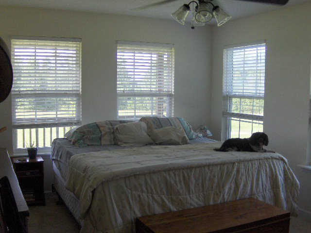 174 Buck Road Gray, GA 31032 - Photo 13 of 25 a bedroom with a bed and a window