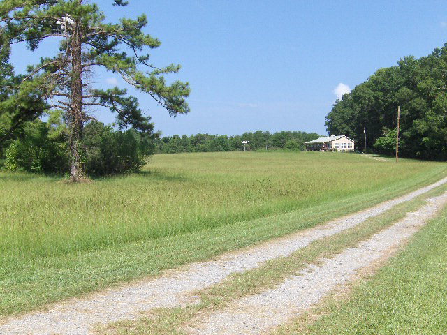 174 Buck Road Gray, GA 31032 - Photo 25 of 25 a view of a lake with a big yard