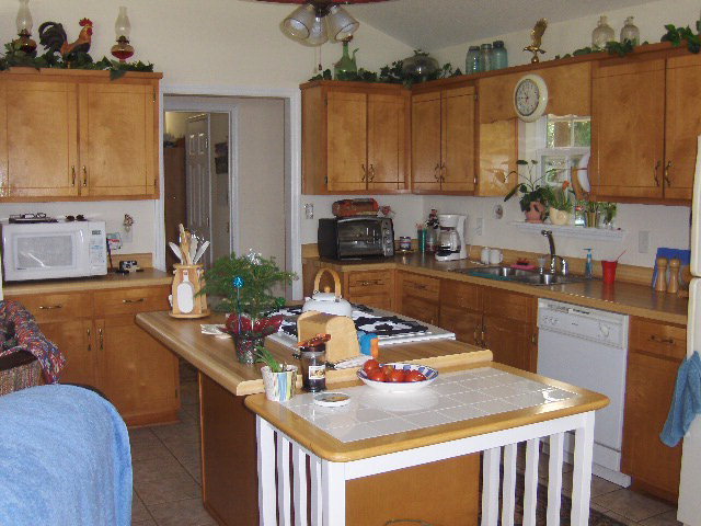 174 Buck Road Gray, GA 31032 - Photo 5 of 25 a kitchen with a sink a stove and cabinets