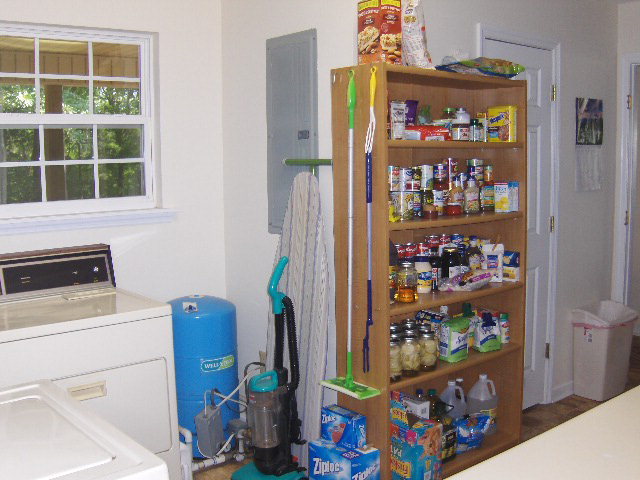 174 Buck Road Gray, GA 31032 - Photo 8 of 25 a view of storage and utility room with fridge and wall