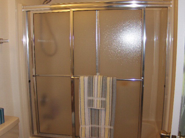 174 Buck Road Gray, GA 31032 - Photo 10 of 25 a bathroom with a glass shower door