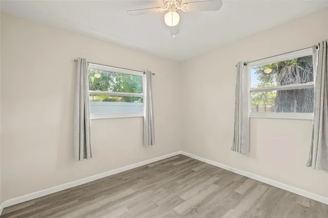 a view of an empty room and wooden floor