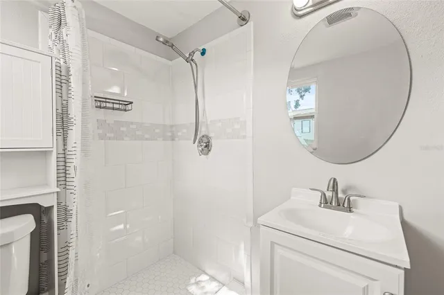 a utility room with wooden floor washer and dryer