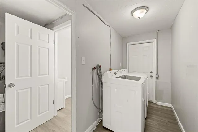 a view of a swimming pool and lounge chairs