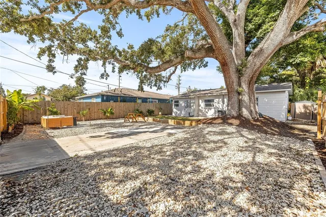 a view of a door with wooden floor and a shower