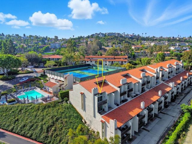an aerial view of houses with yard