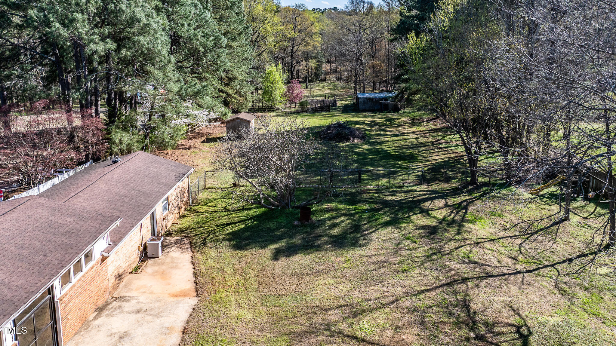 408 Rand Road Raleigh, NC 27603 - Photo 15 of 60 a view of a yard with plants