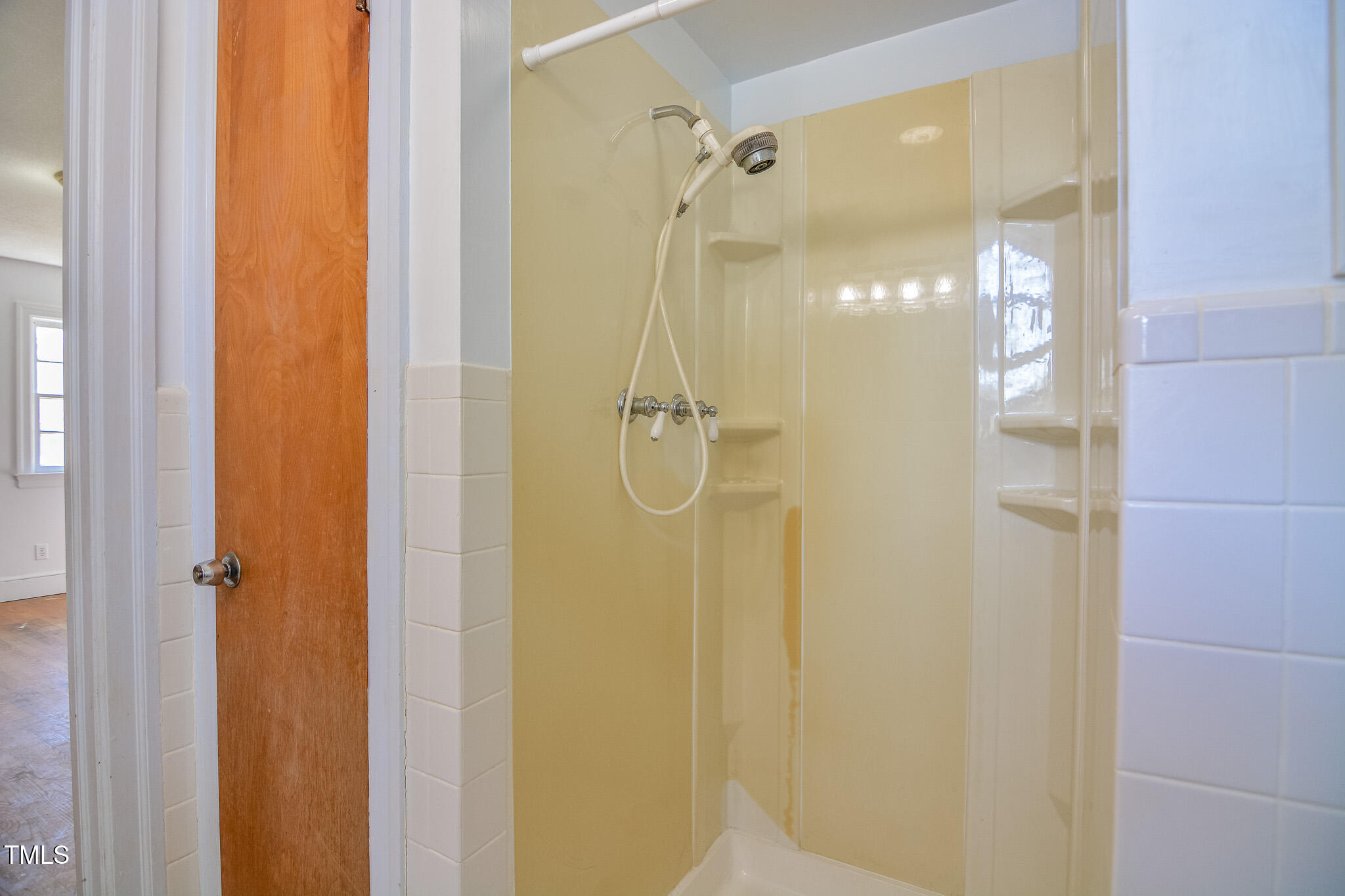 408 Rand Road Raleigh, NC 27603 - Photo 18 of 60 a bathroom with a glass shower door