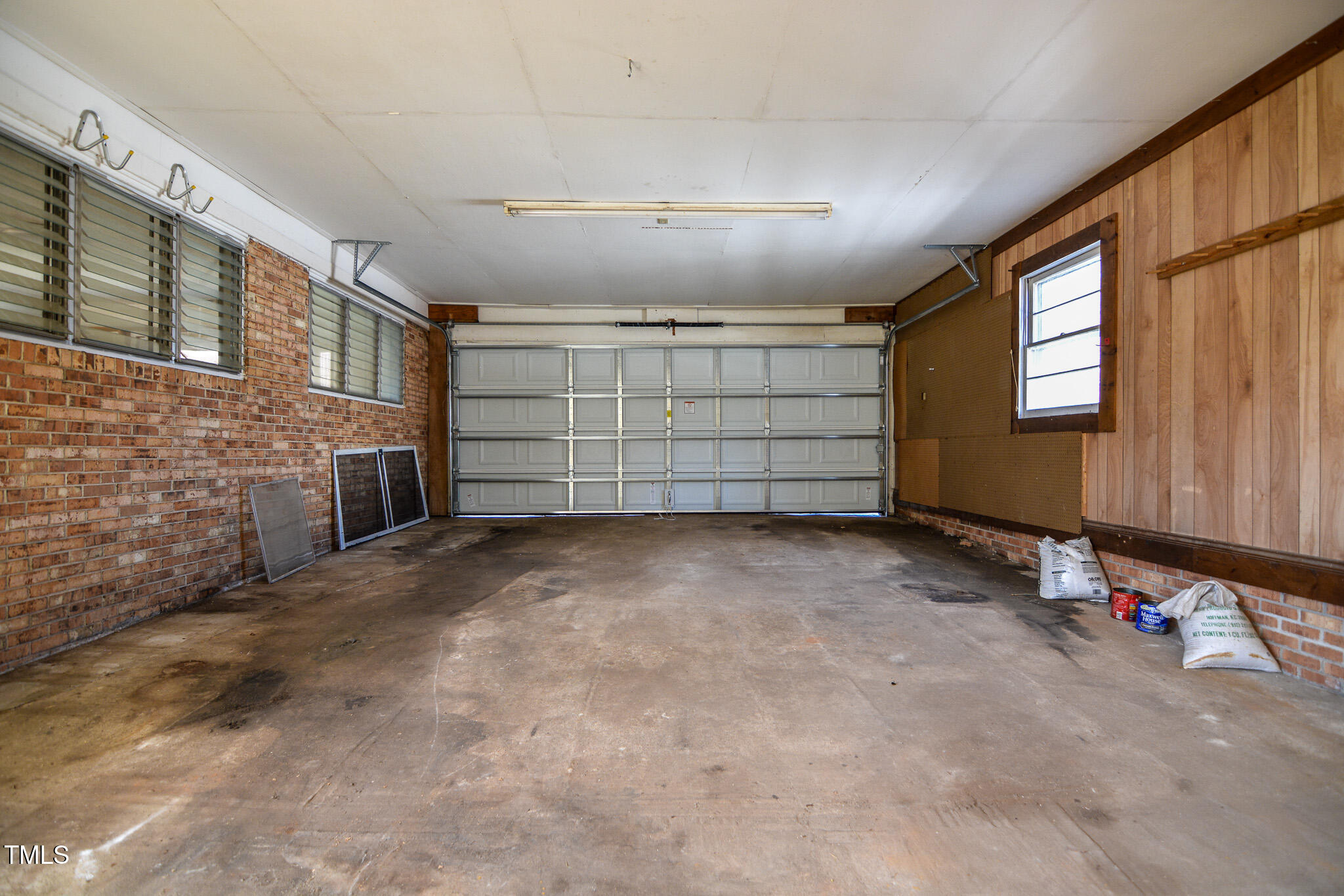 408 Rand Road Raleigh, NC 27603 - Photo 32 of 60 a view of a livingroom with an empty space and a window