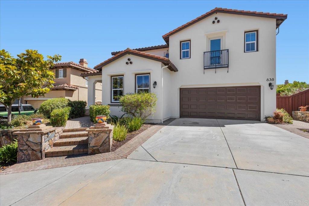 838 Luminara Way San Marcos, CA 92078 - Photo 11 of 54 a front view of a house with garden