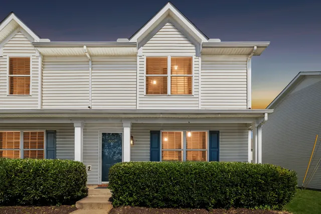 a view of a house with more windows and plants
