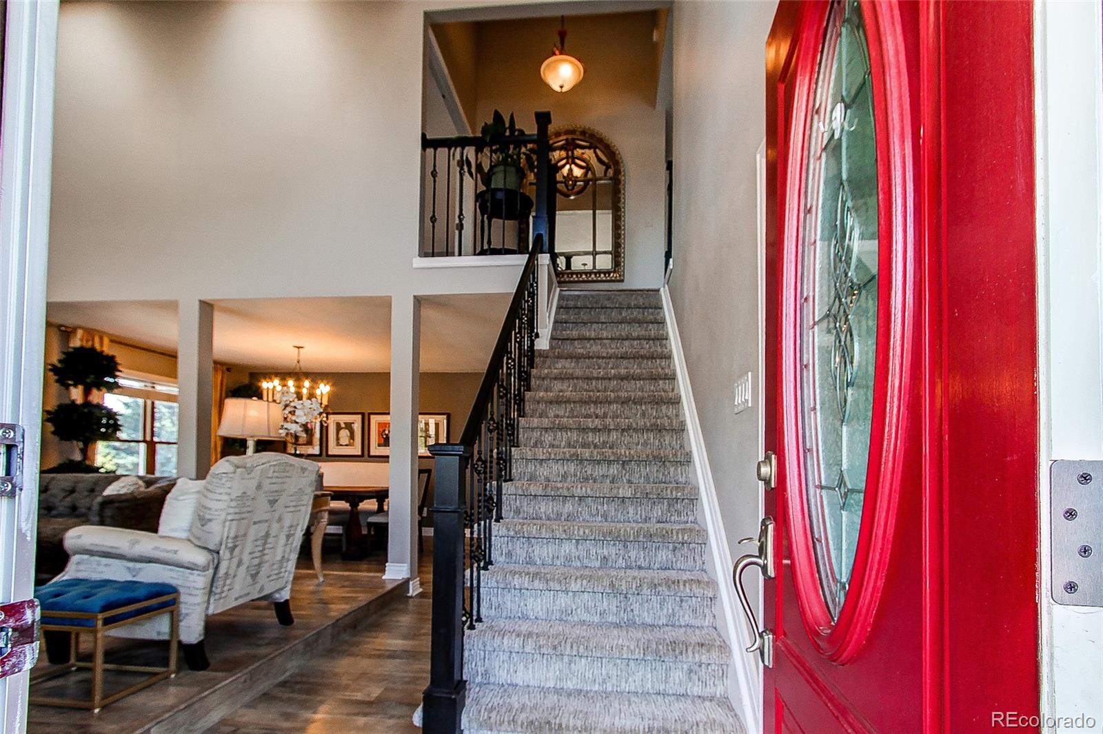 8028 Chaparral Road Lone Tree, CO 80124 - Photo 19 of 40 a view of entryway and hall with wooden floor