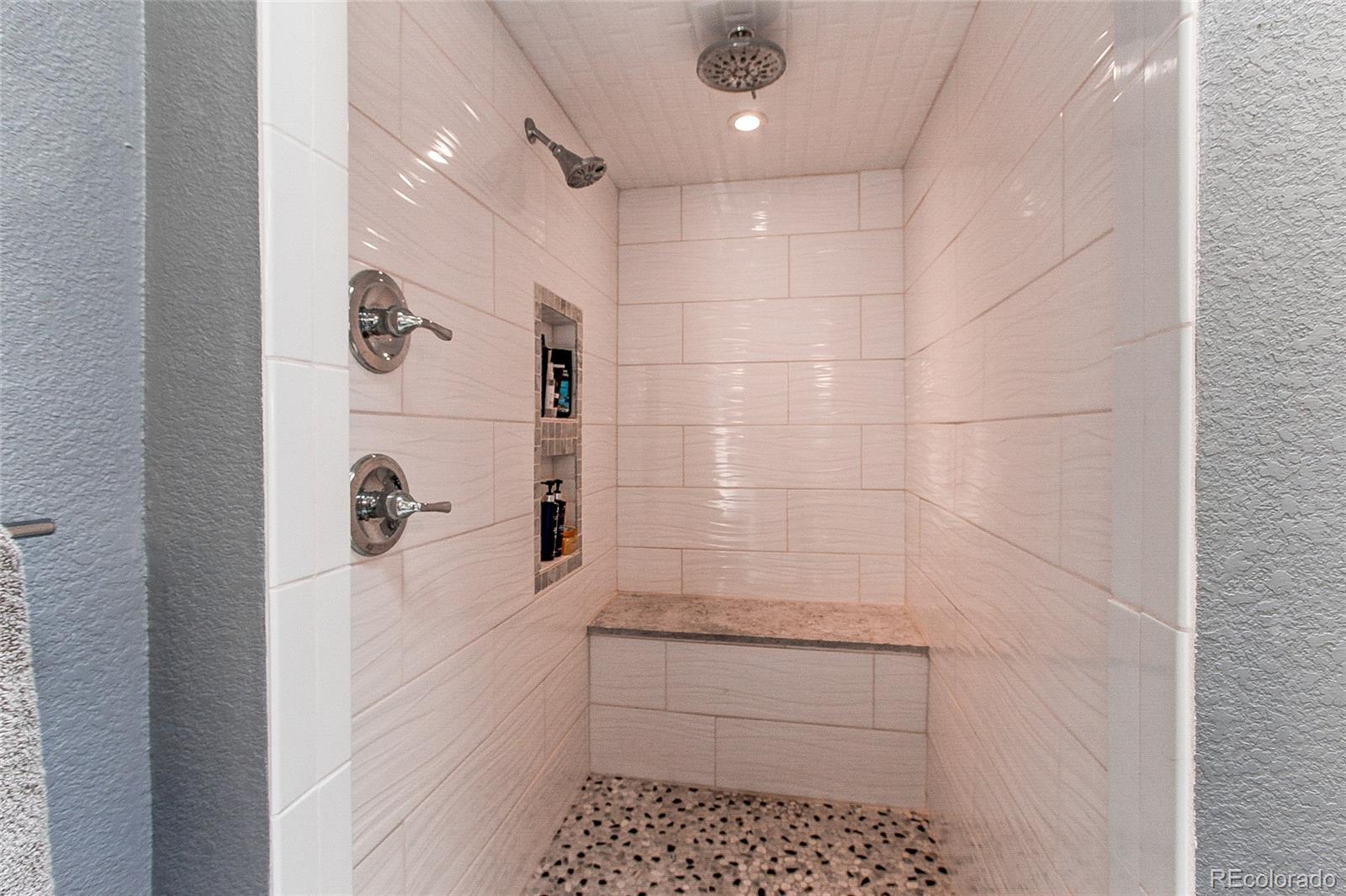8028 Chaparral Road Lone Tree, CO 80124 - Photo 24 of 40 a bathroom with a shower