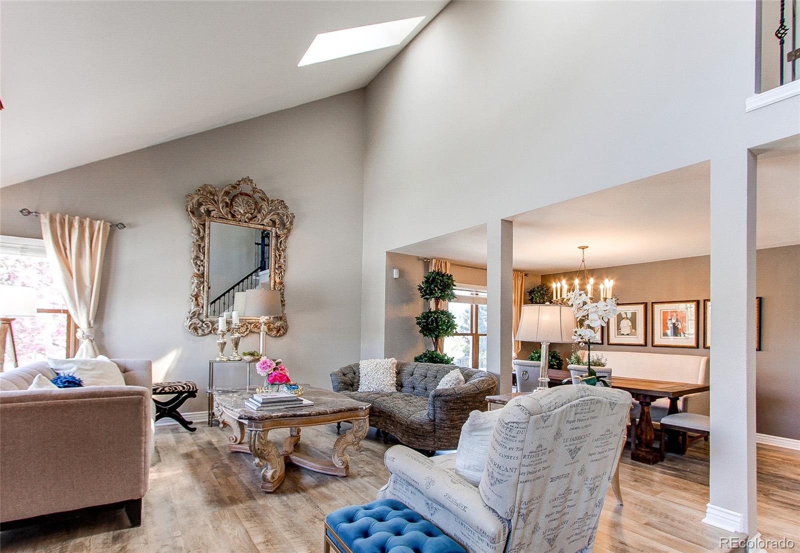 8028 Chaparral Road Lone Tree, CO 80124 - Photo 6 of 40 a living room with furniture and a wooden floor