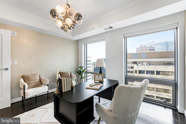 a large white kitchen with cabinets a counter space a sink and appliances