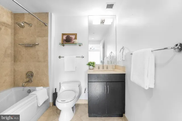 a kitchen with appliances cabinets and a table
