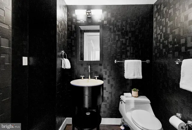 a bedroom with a bed window and couch