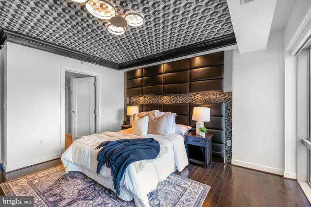 a en suite bathroom with a double vanity sink a mirror and shower