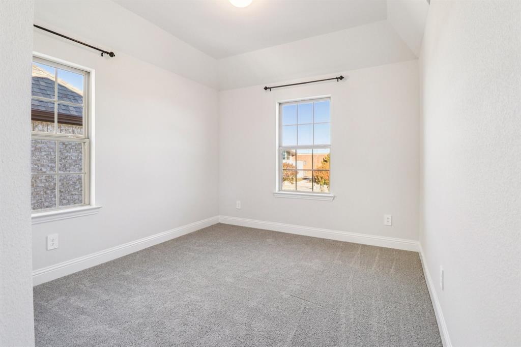 6000 Bursey Road Watauga, TX 76148 - Photo 9 of 13 an empty room with windows