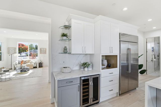 a bathroom with a granite countertop sink a toilet and shower