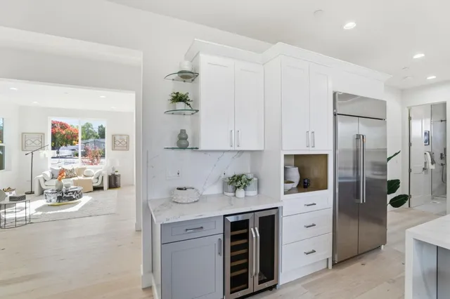 a bathroom with a granite countertop sink a toilet and shower