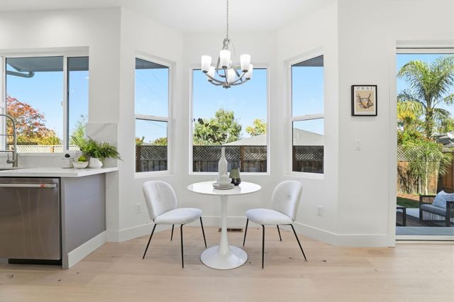 a white bath tub sitting next to a white sink