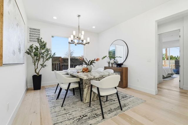 a bathroom with a shower a mirror a sink and glass door shower