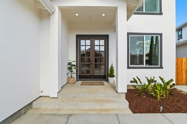 a view of living room with furniture and a large window