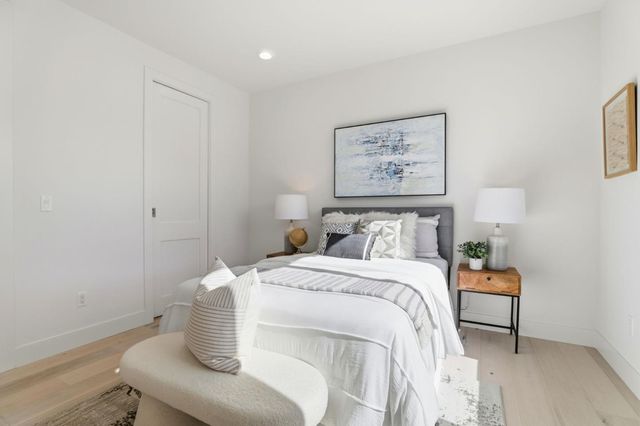 a front view of a house with a yard outdoor seating and barbeque oven