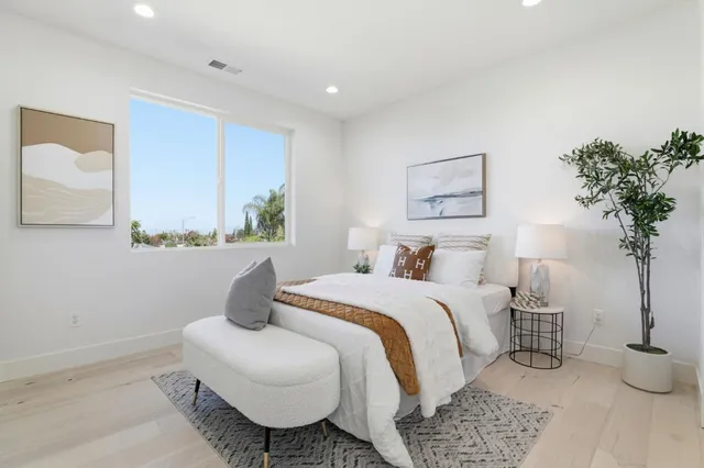 an aerial view of residential houses and lake view