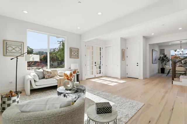 a kitchen with a refrigerator and a stove top oven
