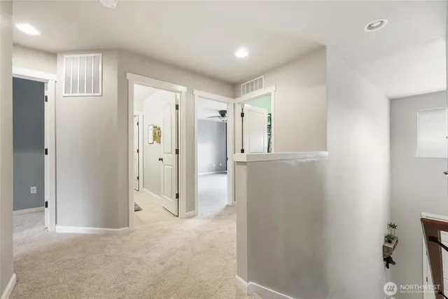 a front view of a house with a garden and plants