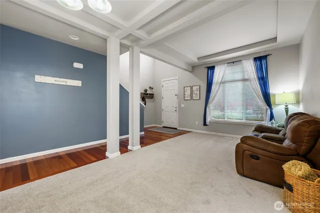 a kitchen with kitchen island granite countertop a large counter top stainless steel appliances and cabinets
