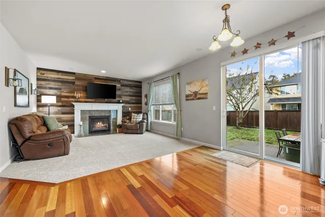 a kitchen with kitchen island granite countertop a sink cabinets and stainless steel appliances