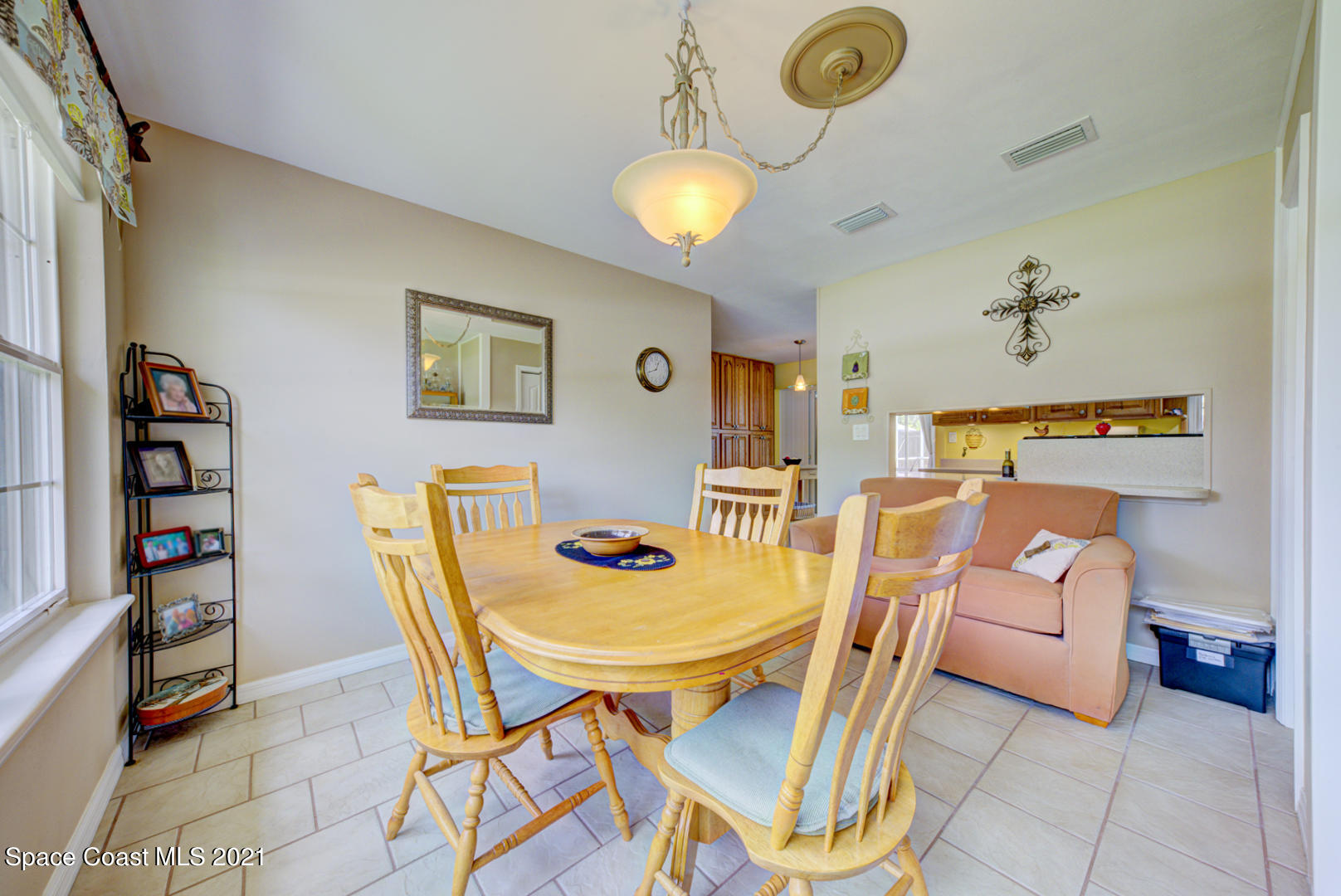 1211 Princeton Road Cocoa, FL 32922 - Photo 19 of 43 dining room with chandelier