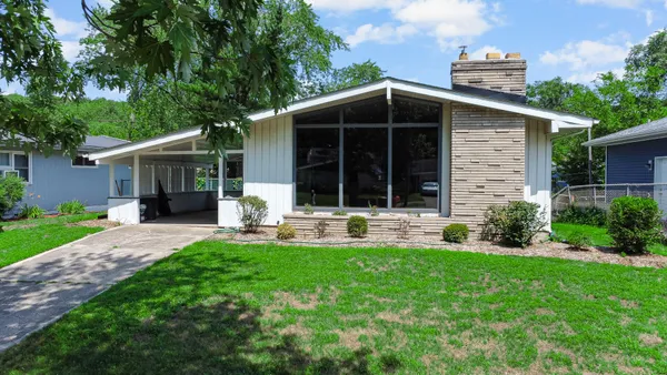 front view of a house with a yard