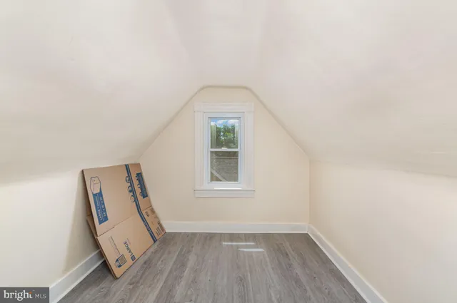 a view of a room with wooden floor and sink