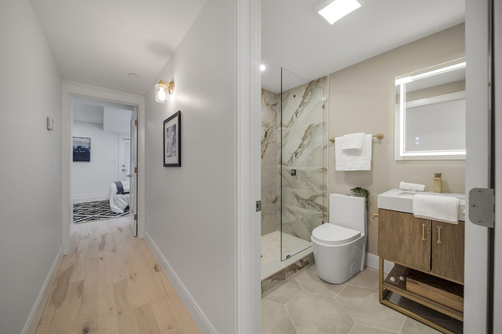 340 Meridian Street, Unit 1 Boston, MA 02128 - Photo 12 of 24 a spacious bathroom with a sink toilet and shower
